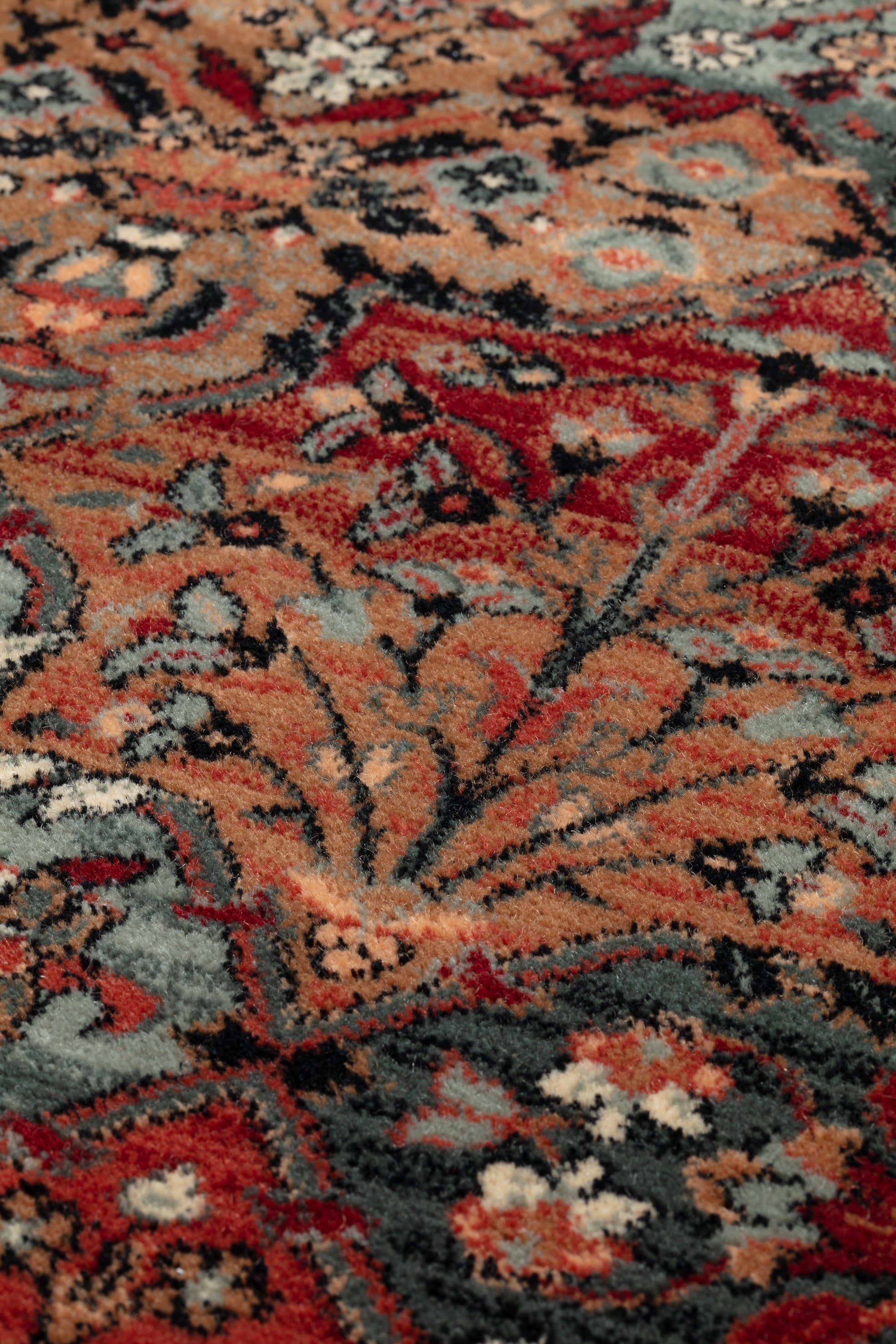  Close-up of a patterned rug with red