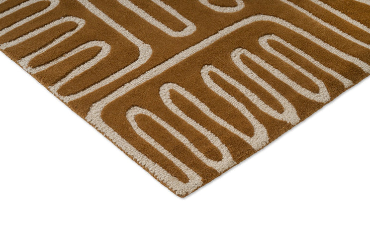 Harlequin Hollow Tan vloerkleed, detail van hoek en pool