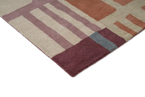 Harlequin Monolith Cinnabar Amber vloerkleed, detail van hoek en pool