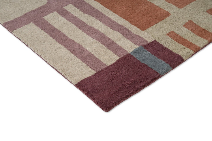 Harlequin Monolith Cinnabar Amber vloerkleed, detail van hoek en pool