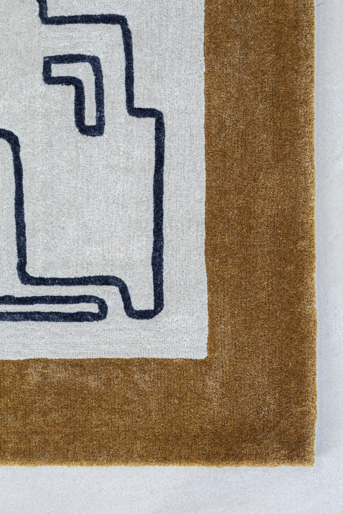 Massimo Structures Fragment 2 Border tapijt, detail van de hoek